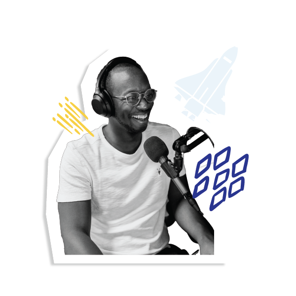 Person with headphones on and wearing a white t-shirt and glasses is sitting at a microphone and smiling