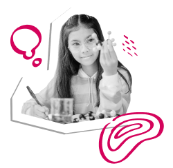 a young girl observing a toy molecule